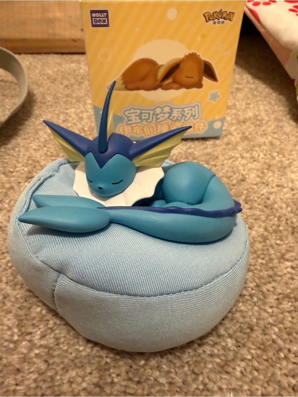 Pokémon Vaporeon Figure Sleeping on Blue Cushion
